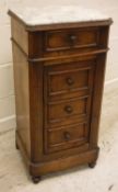 A late 19th Century French walnut marble top pot cupboard with single drawer over a single cupboard
