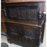 A Victorian oak court cupboard with carved decoration in the 17th Century manner,