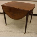 An early 19th Century mahogany oval drop-leaf Pembroke table with single end drawer on square