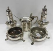 A late Victorian silver five-piece cruet comprising pair of peppers,