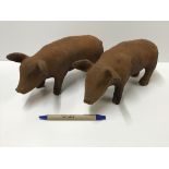 A pair of cast iron Pig ornaments with r