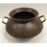 A vintage style steel two-handled handi/