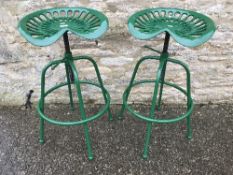 A pair of modern cast metal green painte