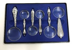 A set of six decorative magnifying glass