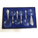 A set of six decorative magnifying glass