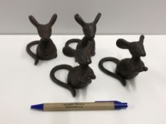 A set of four cast Mouse figures, talles