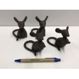 A set of four cast Mouse figures, talles