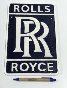 A modern painted cast metal sign "Rolls