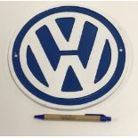 A modern painted cast metal sign "VW", a