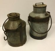 Two vintage style milk churns, one appro