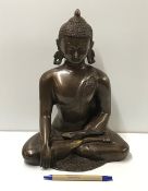 A modern cast bronze statue of Sakyamuni