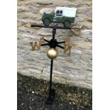 A cast metal weather vane with Landrover