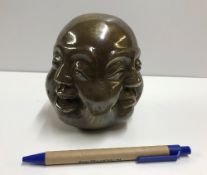 A modern bronze four faced Buddha head w