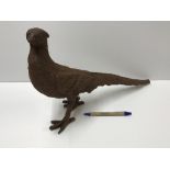 A cast iron Pheasant ornament with rust