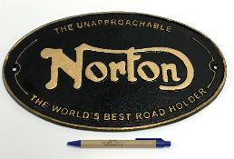 A modern painted cast metal sign "Norton