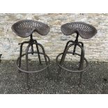 A pair of modern cast metal patinated ad