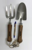 An Amtech wooden handled trowel and fork