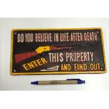 A modern painted cast metal sign "Do You Believe In Life After Death Enter This Property And Find