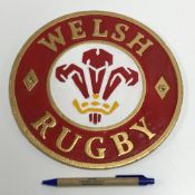 A modern painted cast metal sign "Welsh