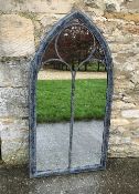 A garden mirror of Gothic arch form, app