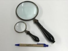 Two decorative magnifying glasses with w