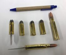 Six various brass bullet shaped penknive