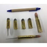 Six various brass bullet shaped penknive