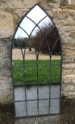 A garden mirror of Gothic arch form, app