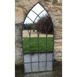 A garden mirror of Gothic arch form, app