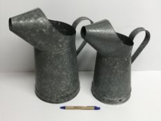 Two galvanised watering jugs / cans, tal