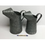 Two galvanised watering jugs / cans, tal