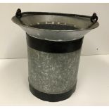 A small bucket with swing handle and bev