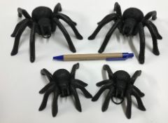 Two pairs of cast Spider ornaments, each