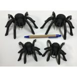 Two pairs of cast Spider ornaments, each