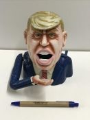 A cast metal "Donald Trump" money box in