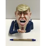 A cast metal "Donald Trump" money box in