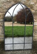 A garden mirror of Gothic arch form, app