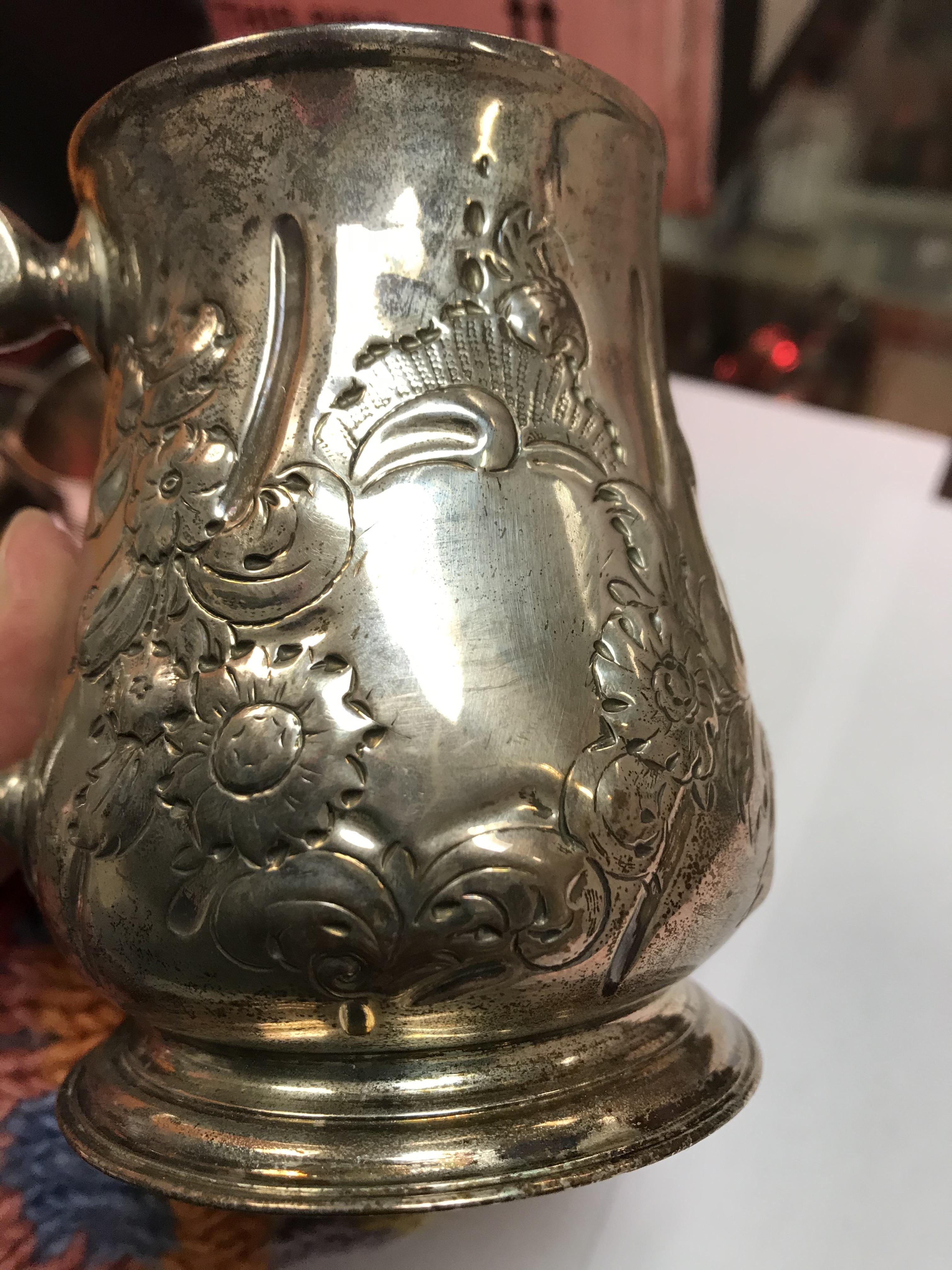A George II silver baluster shaped mug with later foliate engraved decoration, - Image 30 of 42