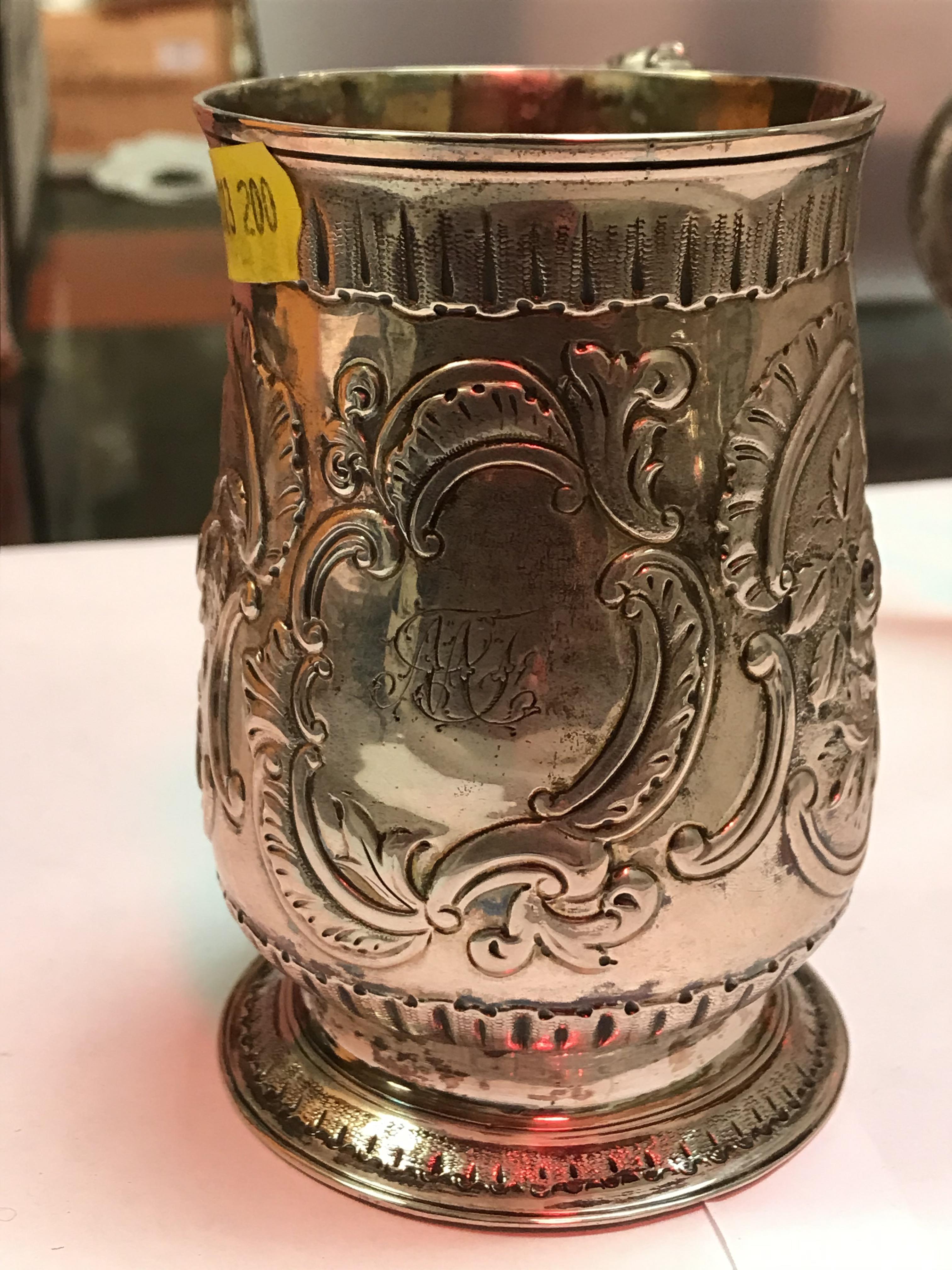 A George II silver baluster shaped mug with later foliate engraved decoration, - Image 7 of 42