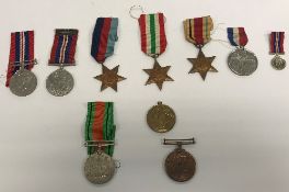 A collection of various medals including a 1914-19 Victory medal awarded to Lieut.