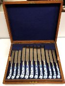 A set of twelve Dresden porcelain "Onion" pattern handled small and large knives with relief work