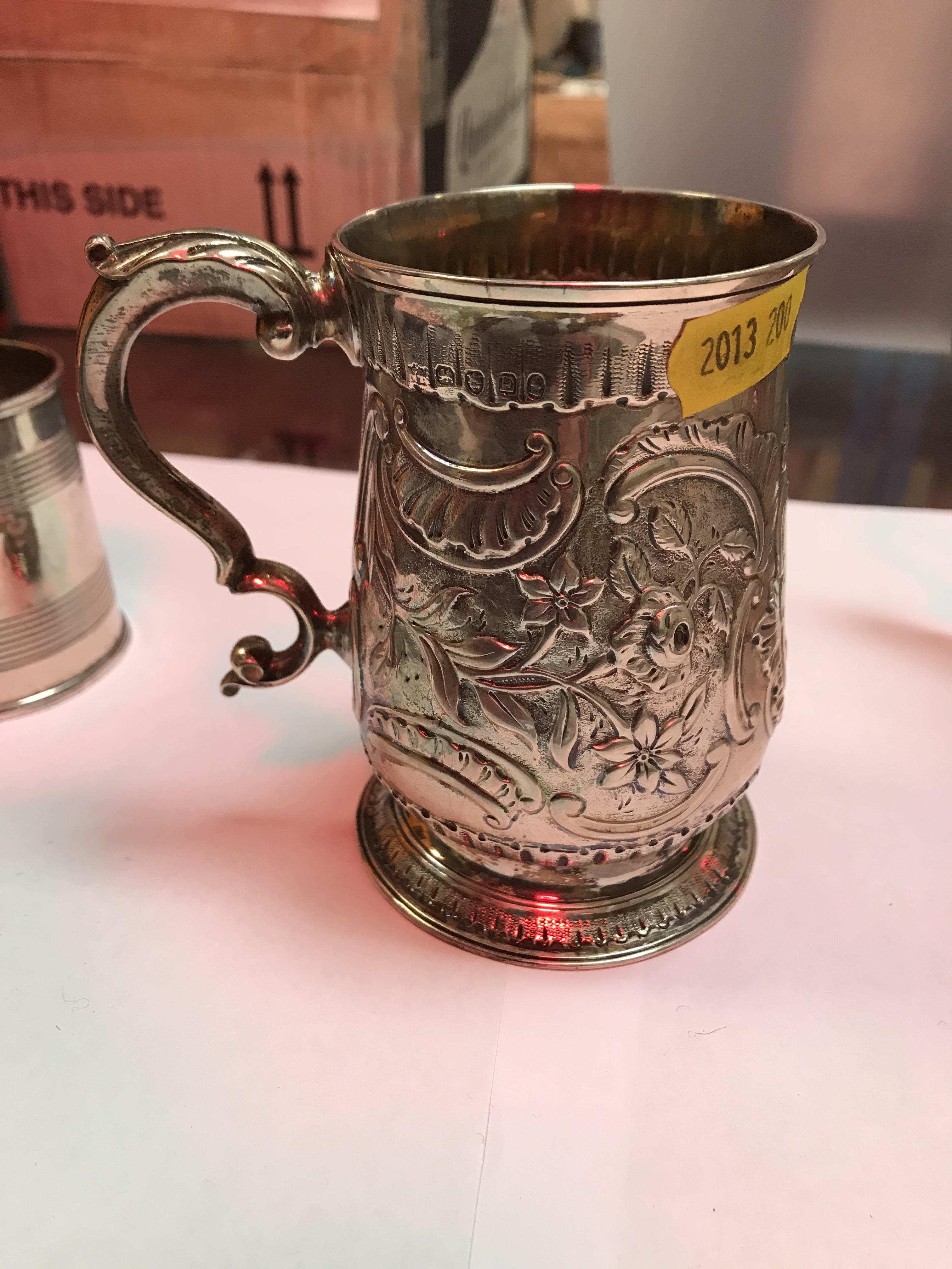 A George II silver baluster shaped mug with later foliate engraved decoration, - Image 3 of 42