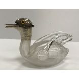 A Victorian blown glass and ribbed duck miniature claret type jug with silver mounts as a duck's