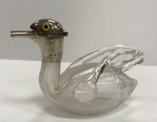 A Victorian blown glass and ribbed duck miniature claret type jug with silver mounts as a duck's