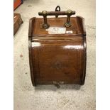 A circa 1900 mahogany and satinwood and cross-banded carved oak coal box in the manner of Dr