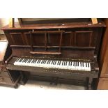 An early 20th Century rosewood cased upright piano,