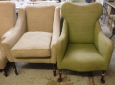 Two modern armchairs, one in beige upholstery,