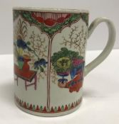 A Worcester Kakiemon pattern mug with panel decoration of dragons and vases of flowers in interiors,