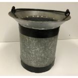 A small bucket with swing handle and bevelled lip, 33.