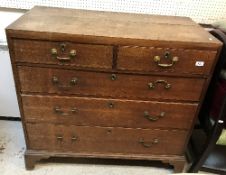 A 19th Century oak chest of two short over three long graduated drawers with brass swan neck